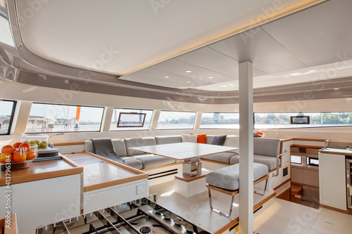 Galley & main saloon inside a catamaran cruising on the Garonne river photo