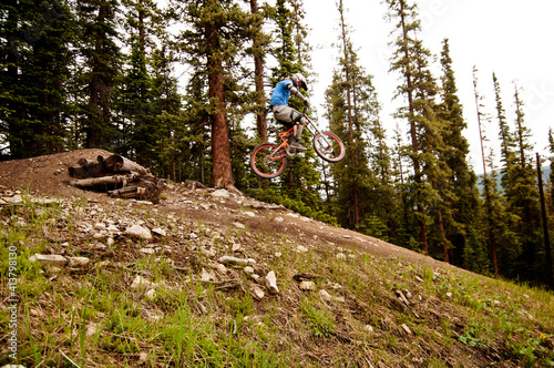 Side view of cyclist performing stunt in mid-air