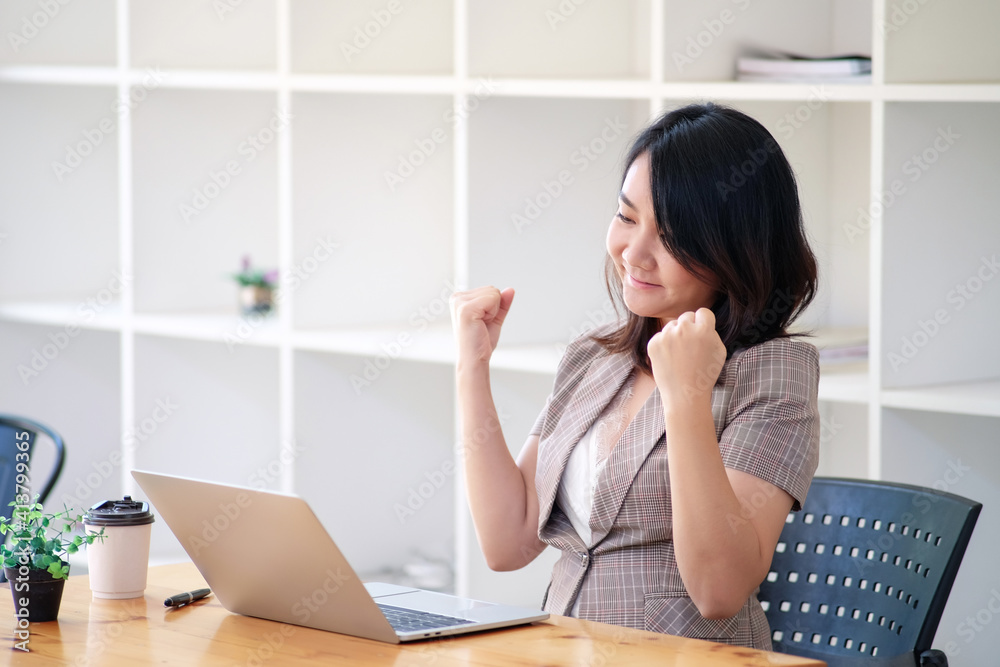 Woman with laptop celebrating success concept, start a business, with copy space. Woman with laptop celebrating success concept, start a business, with copy space.