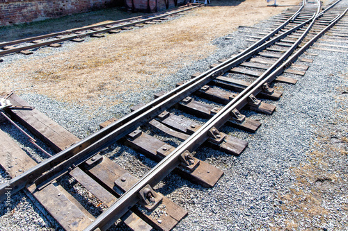 Railroad tracks on a sunny summer day. Railway arrow switch tracks