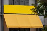 blank yellow sign and canvas awning. exterior canvas roof.