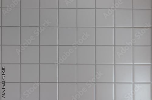 gray square toilet ceramic tile background and texture. grey tile for kitchen wall.
