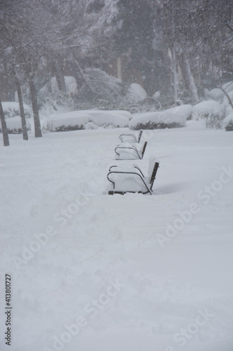 Bench covered in fresh snow