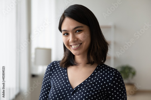 Free Download Headshot portrait of happy millennial female student of asian ethnicity. Confident smiling lady receptionist meet guest. Profile picture of young vietnamese woman blogger tutor looking at web camera - GFXLoad
