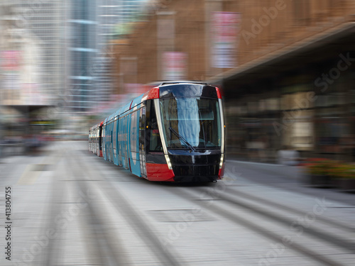 Tram moving through George St in Sydney NSW Australia