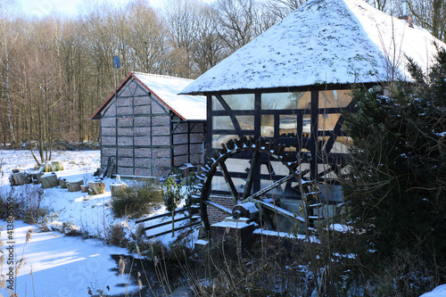 View on isolated half timbered facade with paddle wheel of old water mill - Wegberg, tuschenbroich, Germany © Ralf