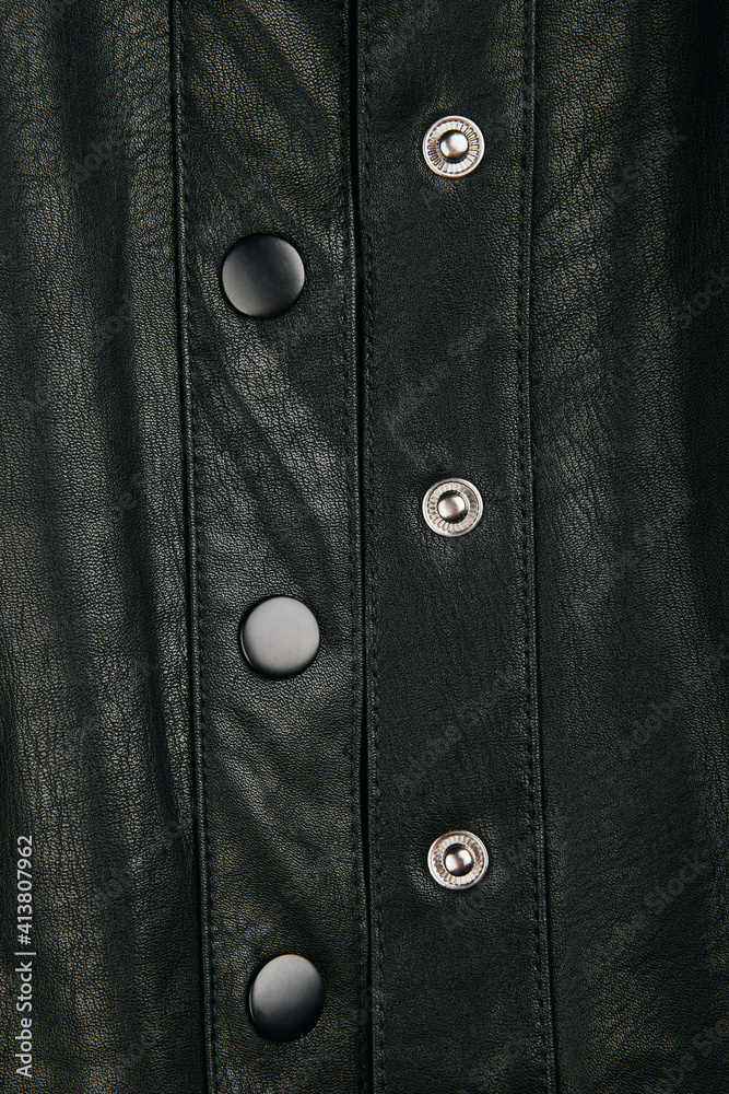 Black leather fabric textile material texture pattern macro blur background.