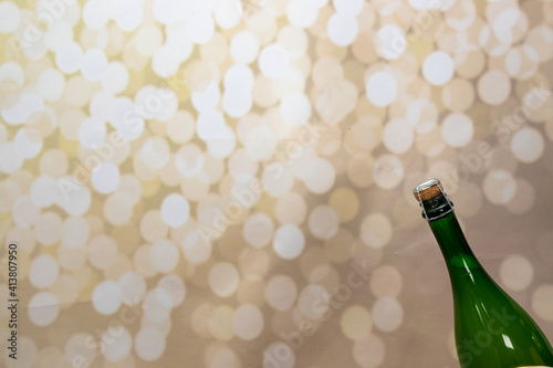 A bottle of wine on a glittery background for a celebration or new years eve concept