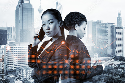 Photography Two young astonishing businesswoman in suits working on forecasting trading corporate strategy at fund