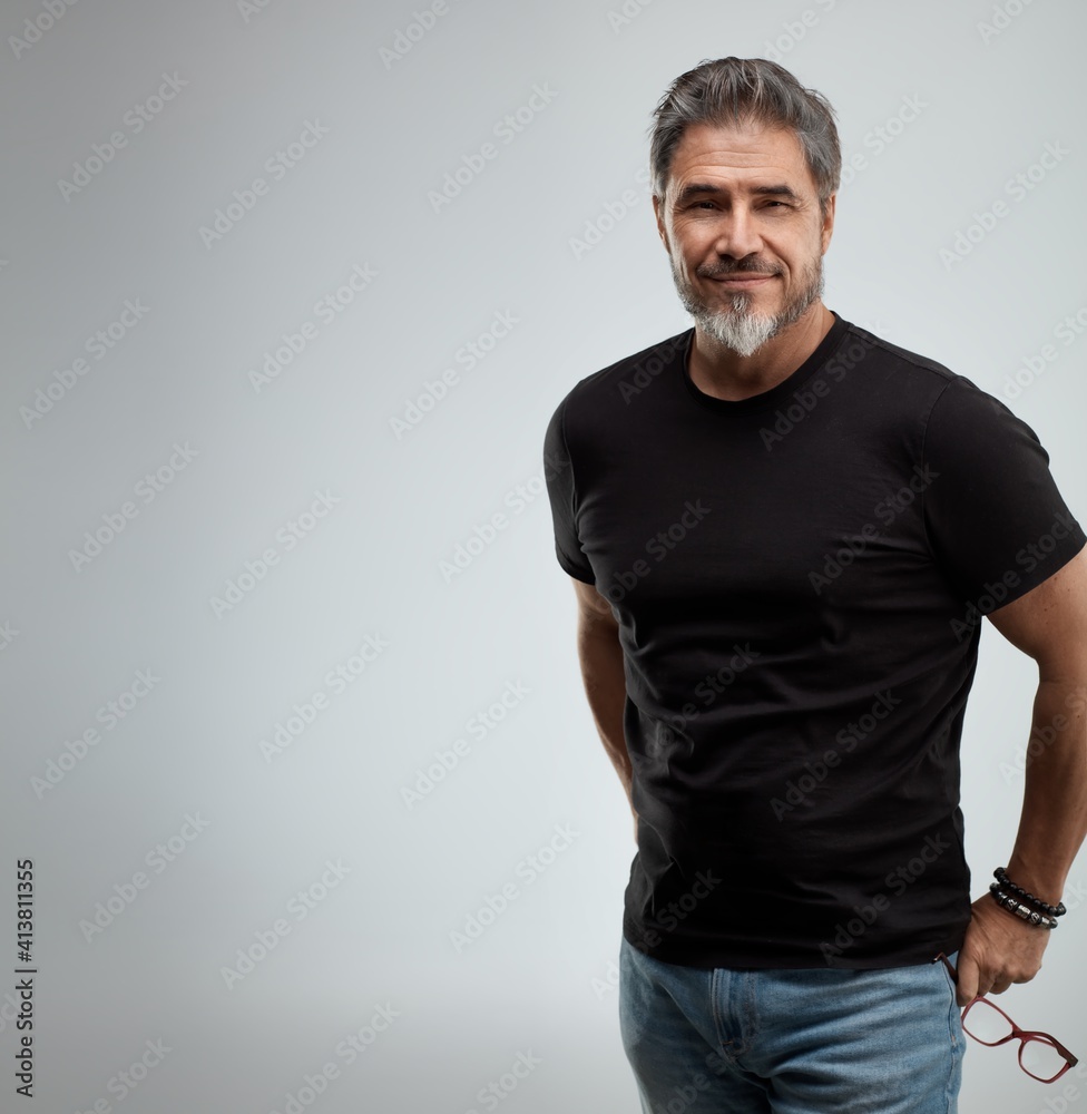 Portrait of older white man, casual guy beard gray hair, smiling. Gray  background and copy space Stock Photo | Adobe Stock