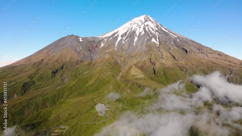 Spectacular birds eye view of cone shaped volcano with snow capped peak. Taranaki, New Zealand Spectacular birds eye view of cone shaped volcano with snow capped peak. Taranaki, New Zealand