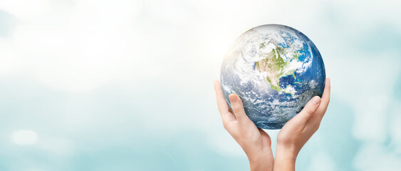 Earth globe in family hands. World environment day
