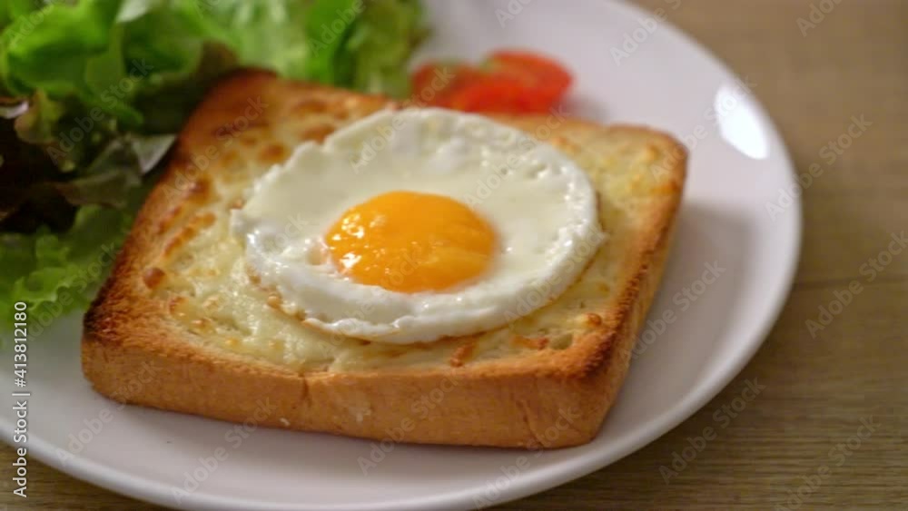 homemade bread toasted with cheese and fried egg on top with vegetable salad for breakfast homemade bread toasted with cheese and fried egg on top with vegetable salad for breakfast