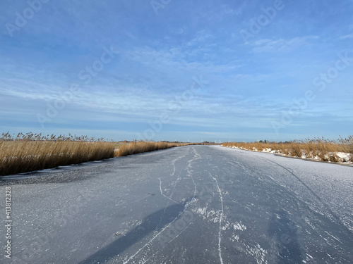 Frozen canal in Friesland photo