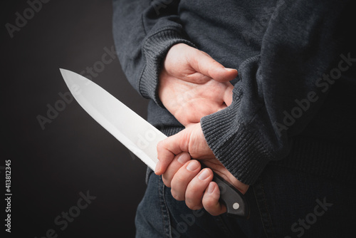 Murderer holding knife in his hand