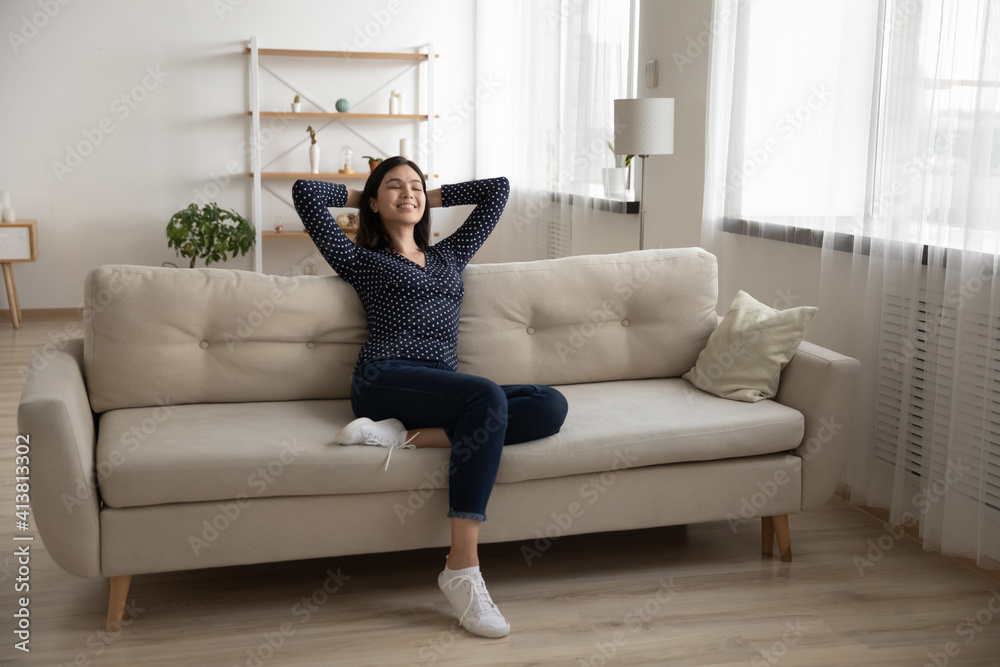 Young serene asian woman rest on soft stylish couch after finishing household chores enjoy tranquility feeling satisfied. Peaceful vietnamese lady chill at modern studio apartment breath fresh air nap Young serene asian woman rest on soft stylish couch after finishing household chores enjoy tranquility feeling satisfied. Peaceful vietnamese lady chill at modern studio apartment breath fresh air nap