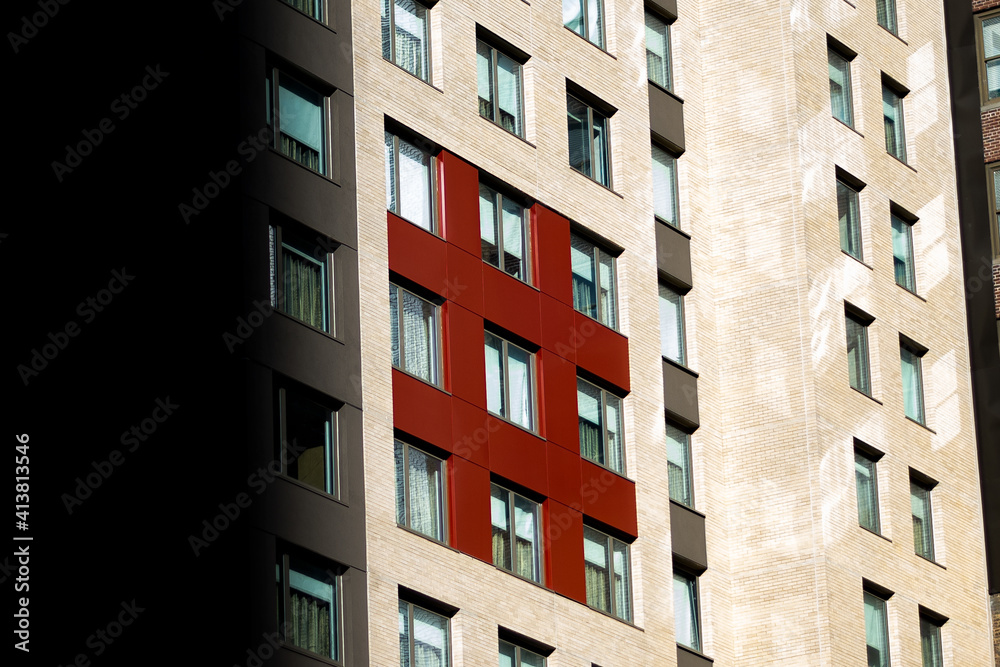 An interesting placement on an random building in new York city resembling an hashtag.