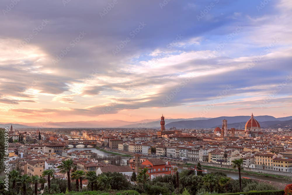 Beautiful sunset over Florence and its famous landmarks. Palazzo Vecchio, Florence Cathedral, Ponte Vecchio. Tuscany, Italy
