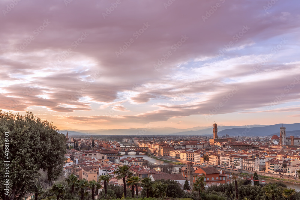Stunning sunset over Florence and its famous landmarks. Palazzo Vecchio, Florence Cathedral, Ponte Vecchio. Tuscany, Italy