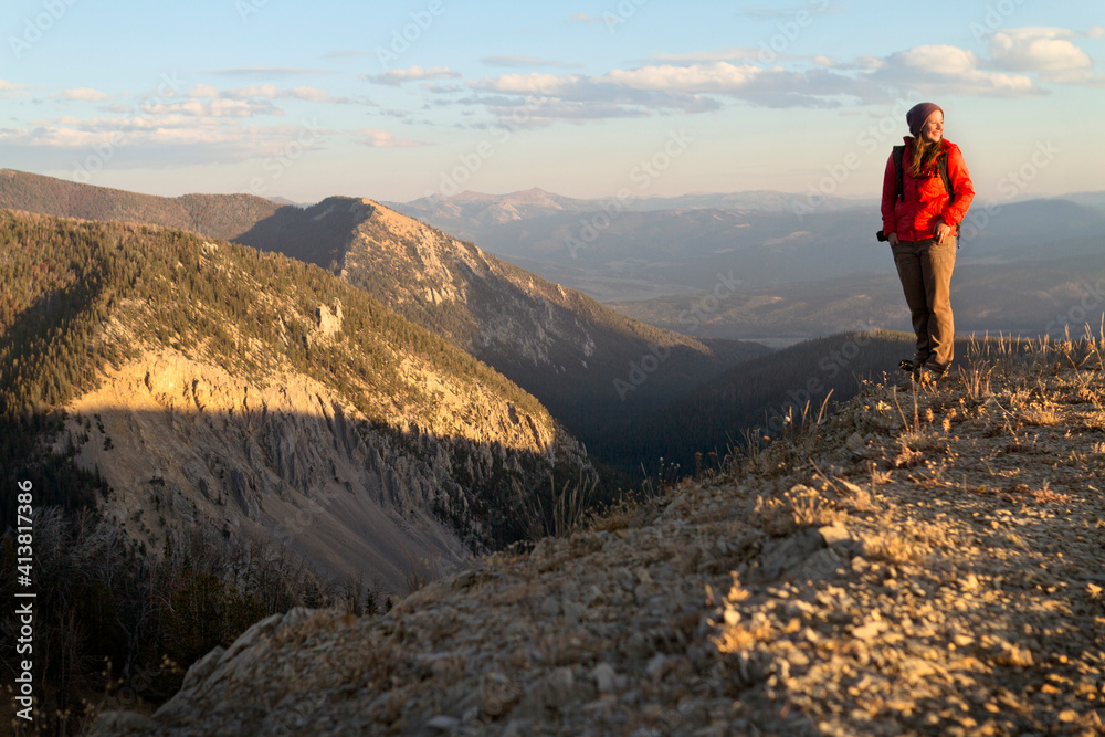 Woman standing on mountain against sky Woman standing on mountain against sky