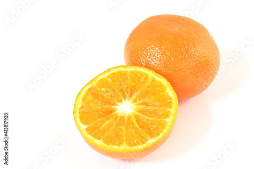 orange half cutting with water drop on white background