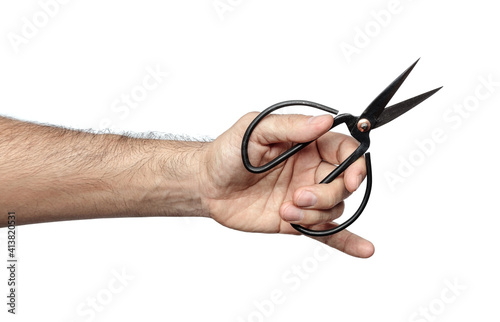 man's hand with scissors isolated white background photo