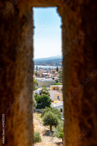 Fototapeta Naklejka Na Ścianę i Meble -  Ruins of old town in Rethymno, Crete, Greece. It largest castle in central Europe. View from the walls window. Port in background