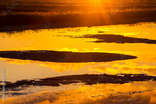 Salt marsh at sunset in Cley Next the Sea, North Norfolk, UK. photo