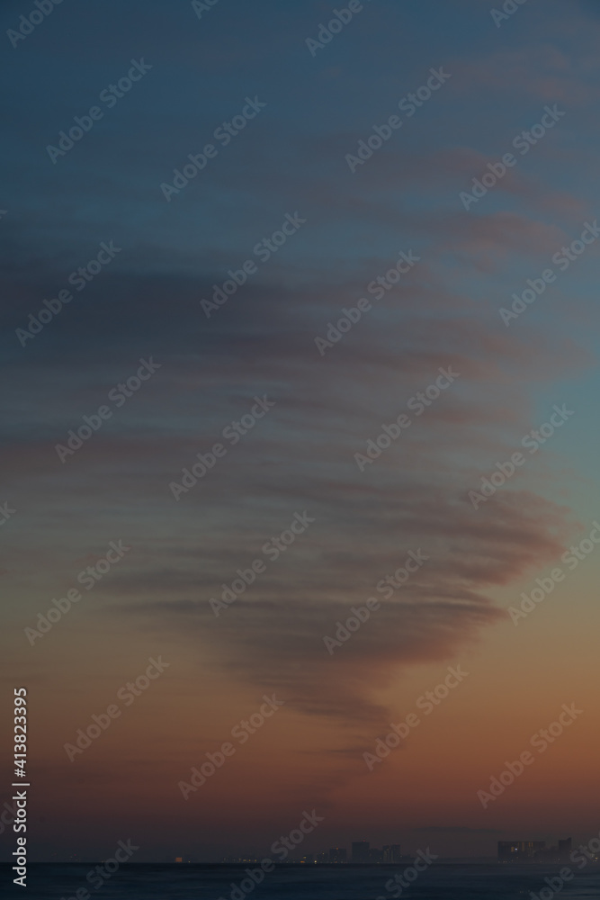 twirly cloud over the sea