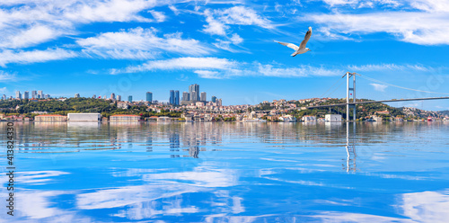 Photography Istanbul coastline panorama with The Bosphorus bridge and skyscrappers on the ba