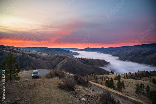 Pink Sunrise In The Mountains With Clouds in The Valley