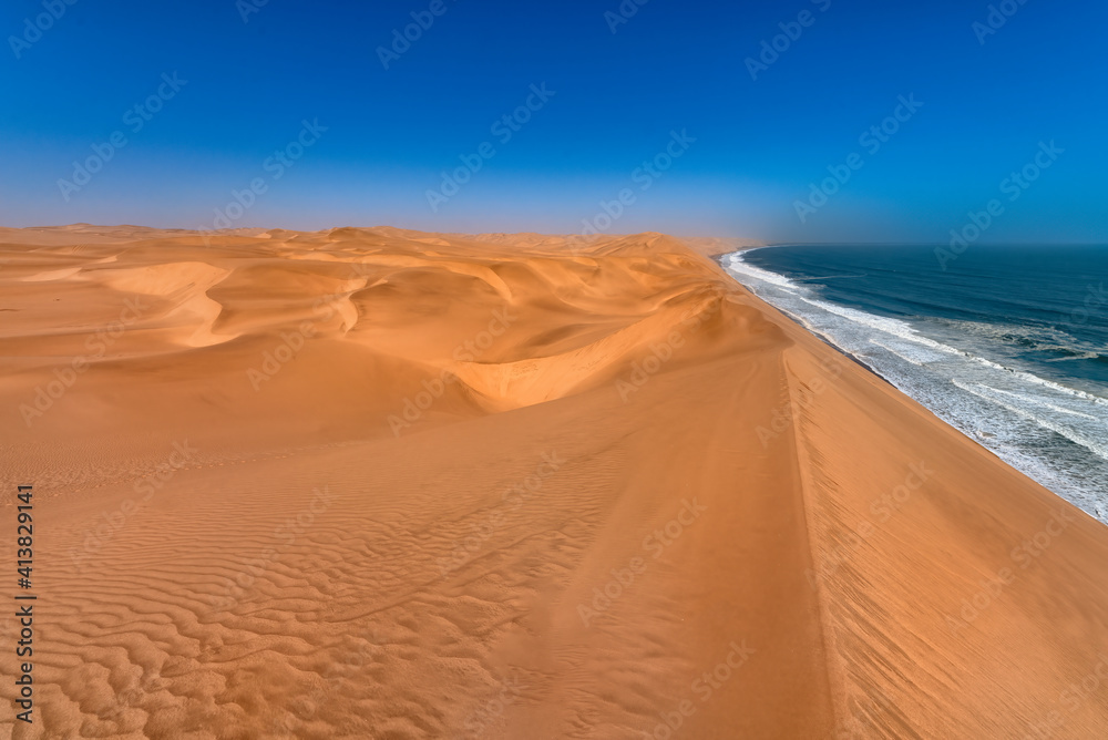Coastline in the Namib desert near Sandwich Harbor. Sandwich Harbor is part of the Namib Naukluft National Park, and is one of the biggest sand fields in the world and a UNESCO world heritage site