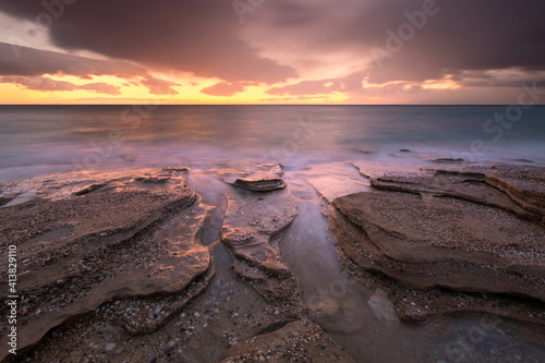 Sandstone rock formations on a beach near Goudouras village, Crete. photo