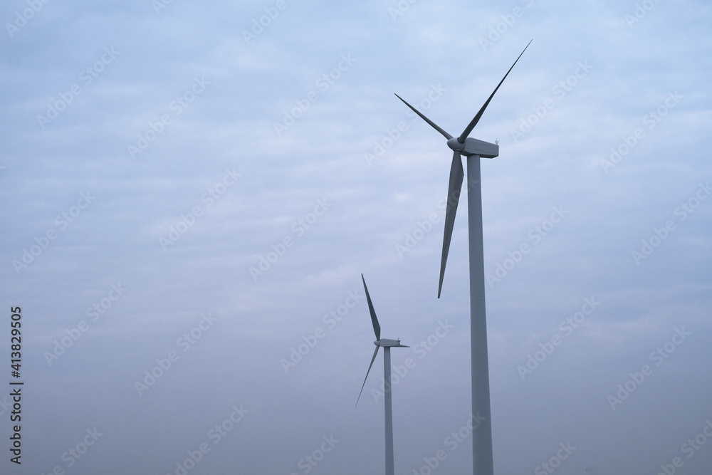 wind power turbine with white cloud sky background wind power turbine with white cloud sky background