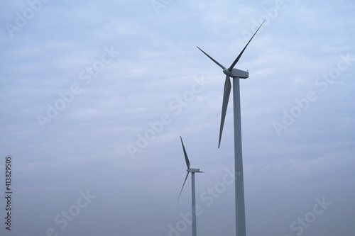 wind power turbine with white cloud sky background  © Robert