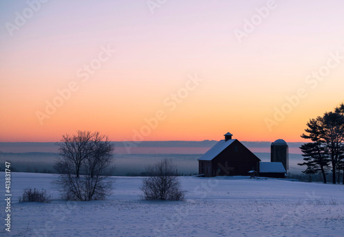 sunrise on a farm with barn
