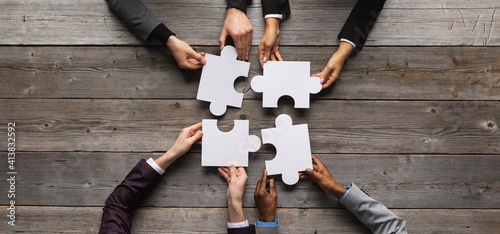 Business teamwork with puzzle photo
