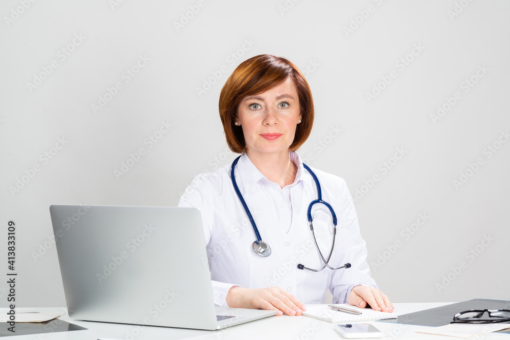Family physician in white coat with stethoscope Family physician in white coat with stethoscope