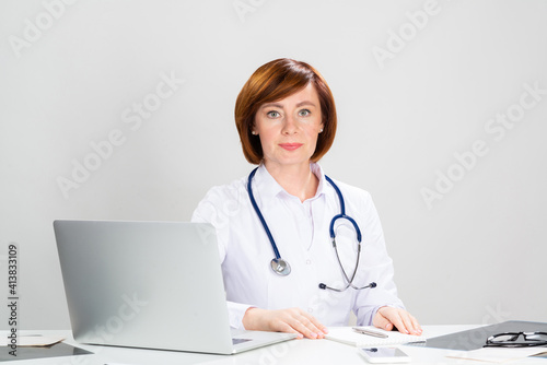 Family physician in white coat with stethoscope