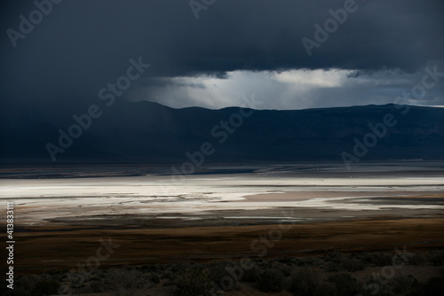 A Storm Passes Through the Badwater Basin Salt Flats Desert In D photo