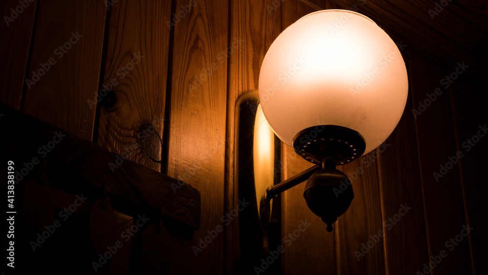 Outdoor exterior small lamp on wooden wall Outdoor exterior small lamp on wooden wall