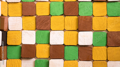 Selective focus close up wooden blog square grid for decorate wallpaper, colorful background design by wood and painting, cube color wood block background. geometric abstract background