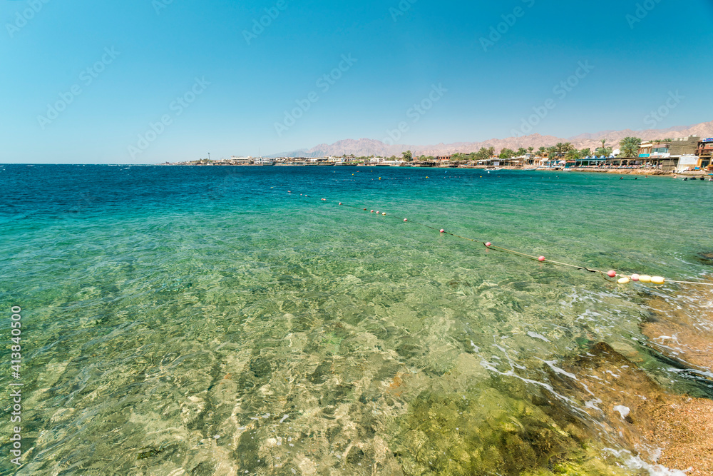 Red Sea Dahab blue water with mountainy in the background Red Sea Dahab blue water with mountainy in the background