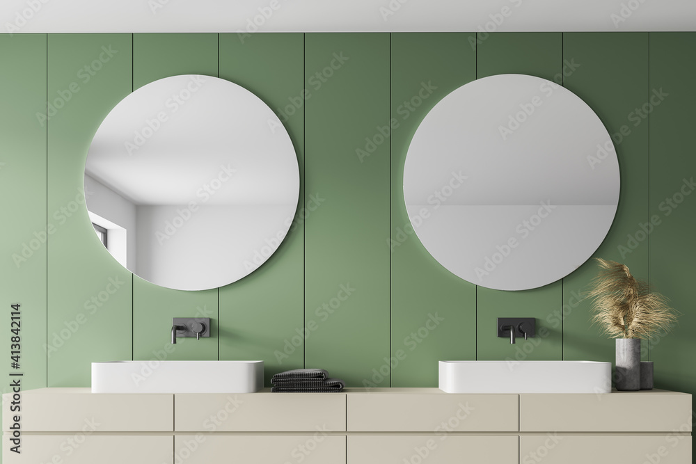 Light green bathroom with two sinks and mirrors, towels and faucets - obrazy, fototapety, plakaty 