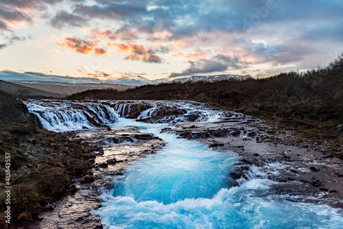 Summer sunset view of Bruarfoss - Br  ar  rfoss Waterfall  secluded spot with cascading blue waters in Iceland Europe  part of the famous golden circle route