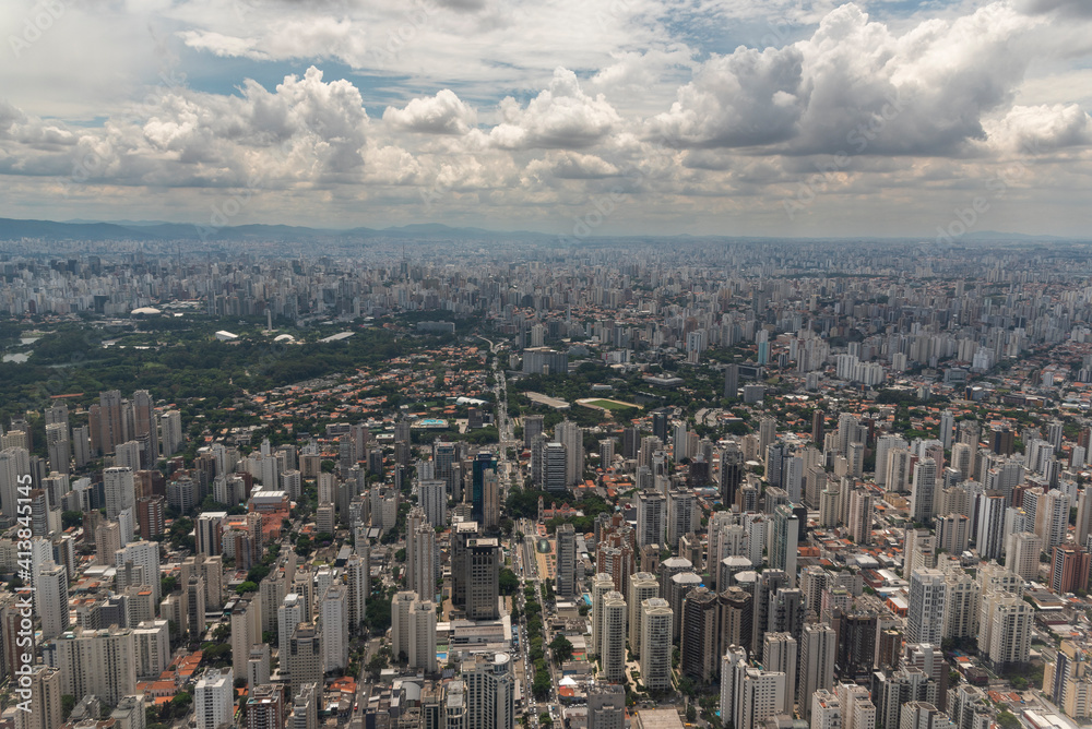 Aerial view to houses and buildings in a large city Aerial view to houses and buildings in a large city