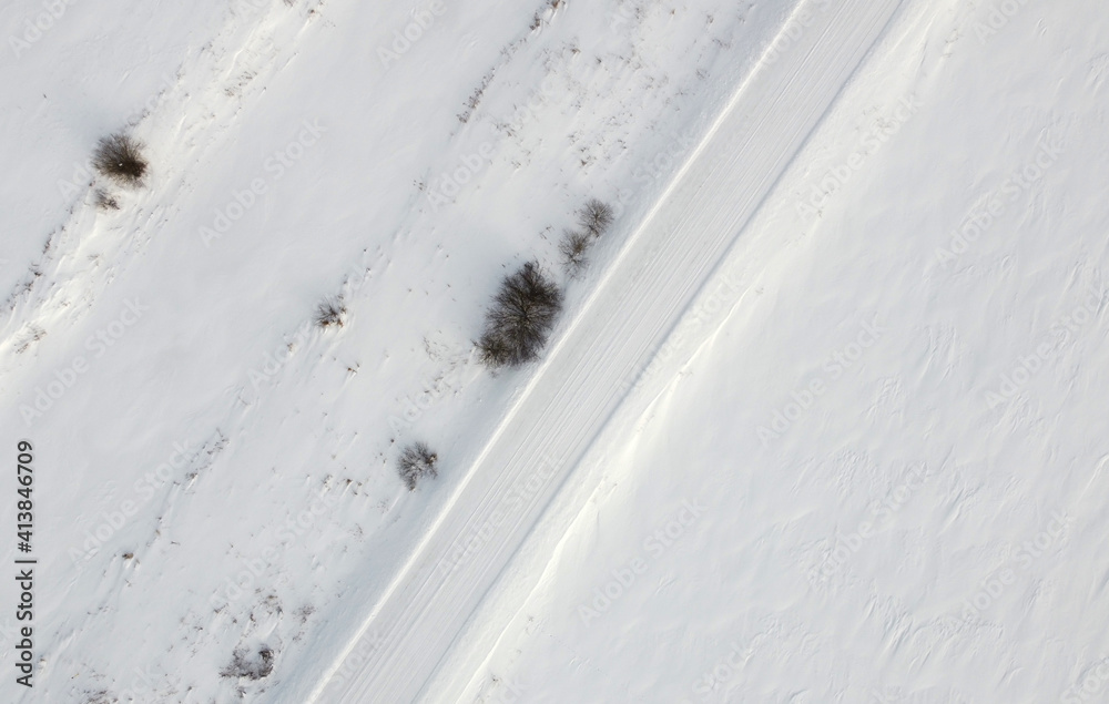 Top view of rural snowy road in winter Top view of rural snowy road in winter