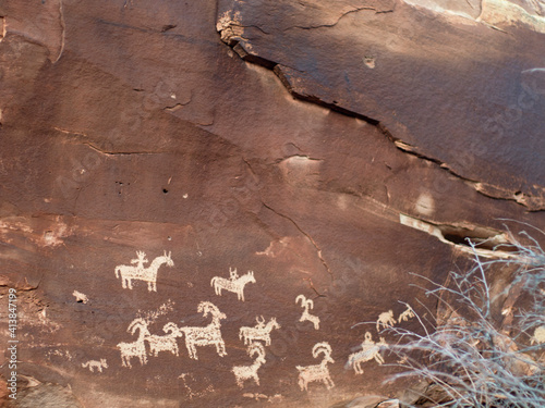 Petroglyphs on a rock wall, Arches National Park. photo