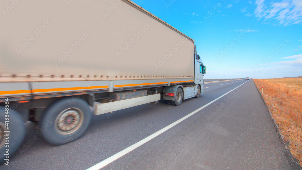Truck on the asphalt road - Commercial cargo delivery truck
