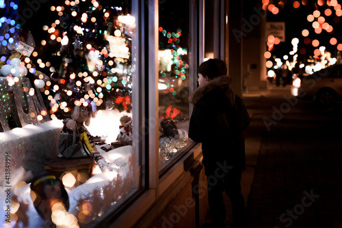 Wallpaper Mural Small Young Boy Looking At Christmas Decorations Inside A Store Window Torontodigital.ca